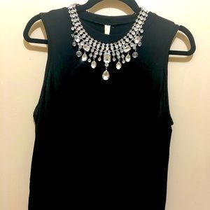 A cold shoulder dress and a statement necklace